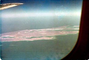 1979_off_australia Feb 8, 1979, mid-morning. Window picture of an atoll somewhere in the Indian Ocean off the west coast of Australia. MCS, part of the 9M-MCS call-sign of our Malaysian Airline System's Boeing 707-300 aircraft was clearly visible on the wing.