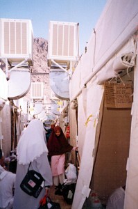 20000319_mina_camp_corridor Sun March 19, 2000 (13 Dzulhijjah 1420). My other half, walking towards her friend, in our Maktab 82 camp in Mina. The tents' air-conditioning units could be clearly seen above our heads.