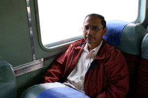IMG_8100_IP_in_seat_self_en Me in Wilfred's window seat. I was assigned the aisle seat next to Wilfred, and since he wanted the ability to move around without disturbing me, he offered to swap seat with me